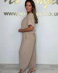 Cymara - Katoenen jumpsuit met V-hals en strikdetail