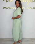 Cymara - Katoenen jumpsuit met V-hals en strikdetail