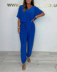 Cymara - Katoenen jumpsuit met V-hals en strikdetail
