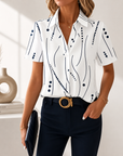 Talyria - Damesblouse in blauw met abstracte print en korte mouwen