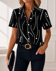 Talyria - Damesblouse in blauw met abstracte print en korte mouwen