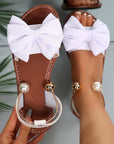 Jaxoria - Vrouwen platte sandalen met decoratieve strik en parels