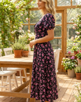Cirella - Midi jurk voor dames in zwart met roze bloemenprint