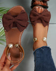 Jaxoria - Vrouwen platte sandalen met decoratieve strik en parels