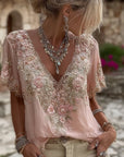Kirelina - Vrouwelijke blouse met geborduurde bloemen en elegante V-hals