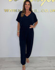 Cymara - Katoenen jumpsuit met V-hals en strikdetail