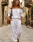 Brixavelle - Dames jumpsuit met blote schouders en strik taille van katoen