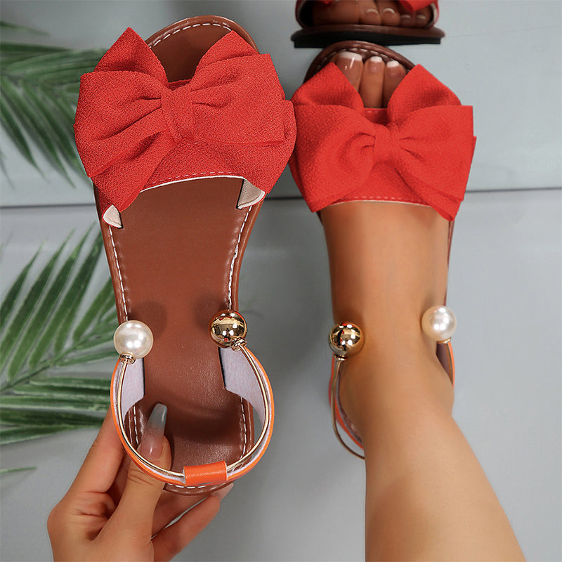 Jaxoria - Vrouwen platte sandalen met decoratieve strik en parels