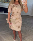 Dorevina - Elegante dames jurk met bloemenprint, korte mouwen en getailleerde pasvorm
