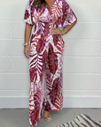 Lucia - Vrouwelijke tropische jumpsuit met korte mouwen en V-hals