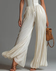 Nexavira - Elegante plissé jumpsuit met brede benen voor avonden