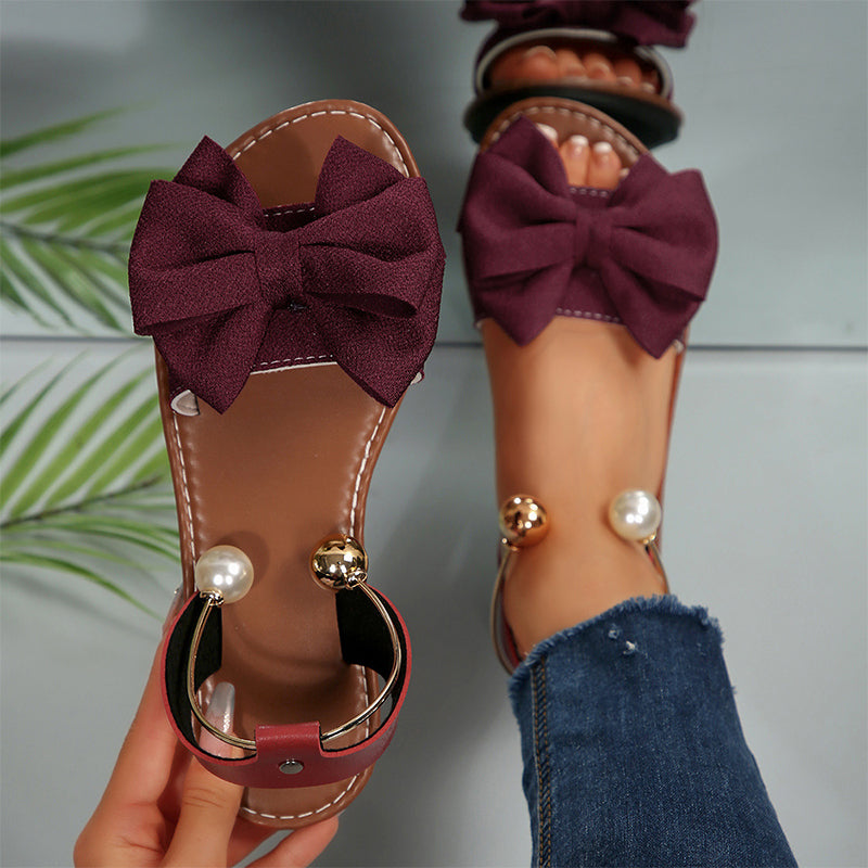 Jaxoria - Vrouwen platte sandalen met decoratieve strik en parels