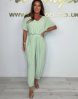 Cymara - Katoenen jumpsuit met V-hals en strikdetail