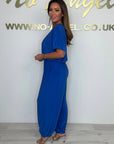 Cymara - Katoenen jumpsuit met V-hals en strikdetail