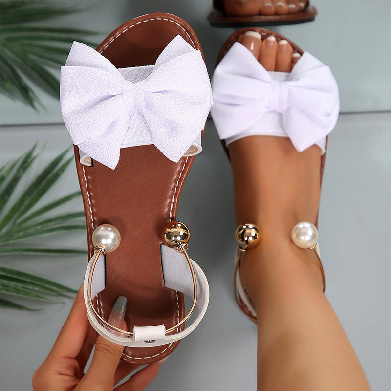 Jaxoria - Vrouwen platte sandalen met decoratieve strik en parels