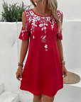 Elanora - Strapless jurk met bloemenprint en uitgesneden mouwen