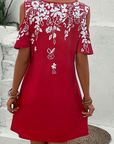 Elanora - Strapless jurk met bloemenprint en uitgesneden mouwen